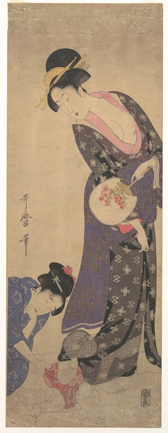 Two Women with a Baby who is Playing on the Floor
