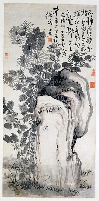 Chrysanthemums by a Rock