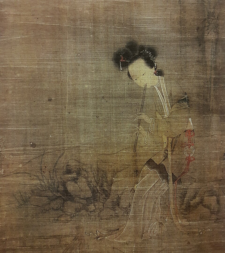 A small portrait of Lu Zhu playing the flute.