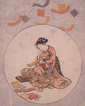 七夕の短冊を書く美人