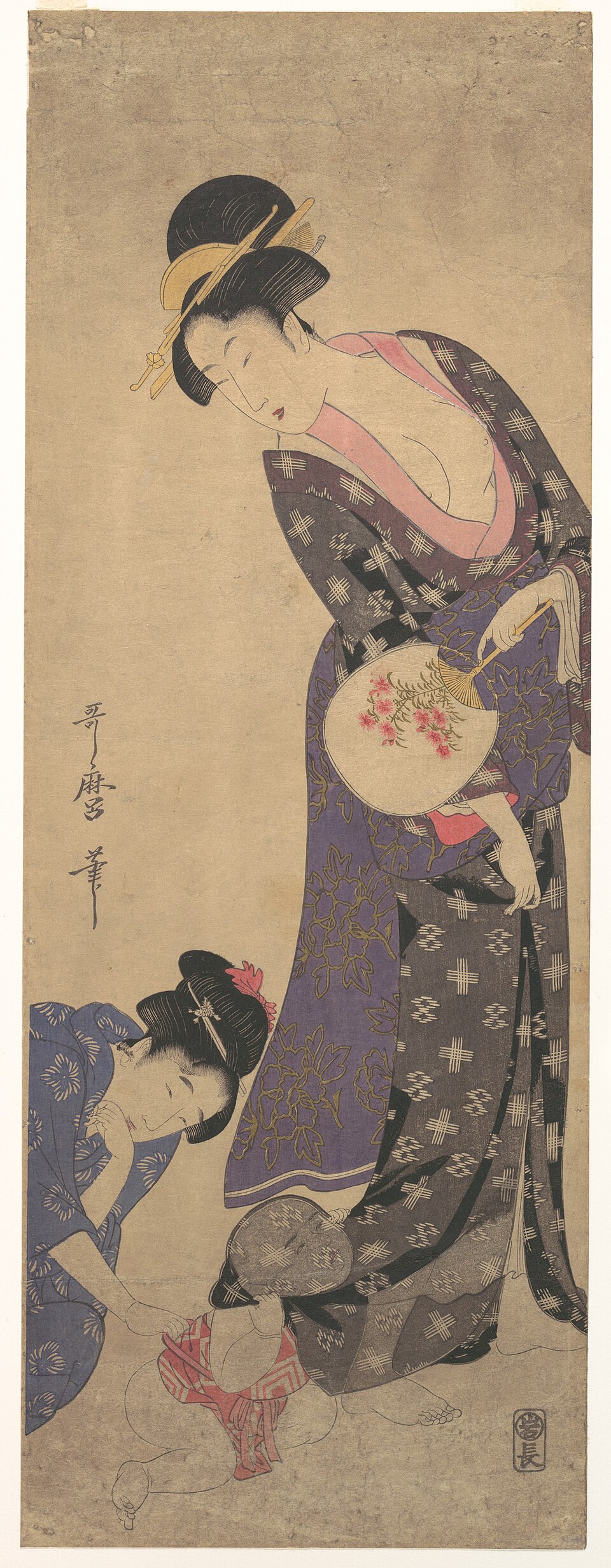 Two Women with a Baby who is Playing on the Floor